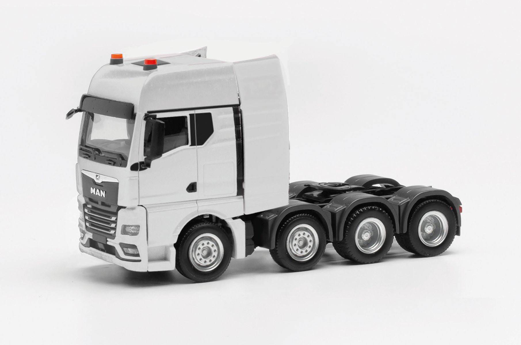 Herpa Modellino camion MAN TGX GX trattore con gru di carico 3 assi (6x4), nero, miniatura in scala 1:87, pezzo da collezione, Made in Germany, plastica