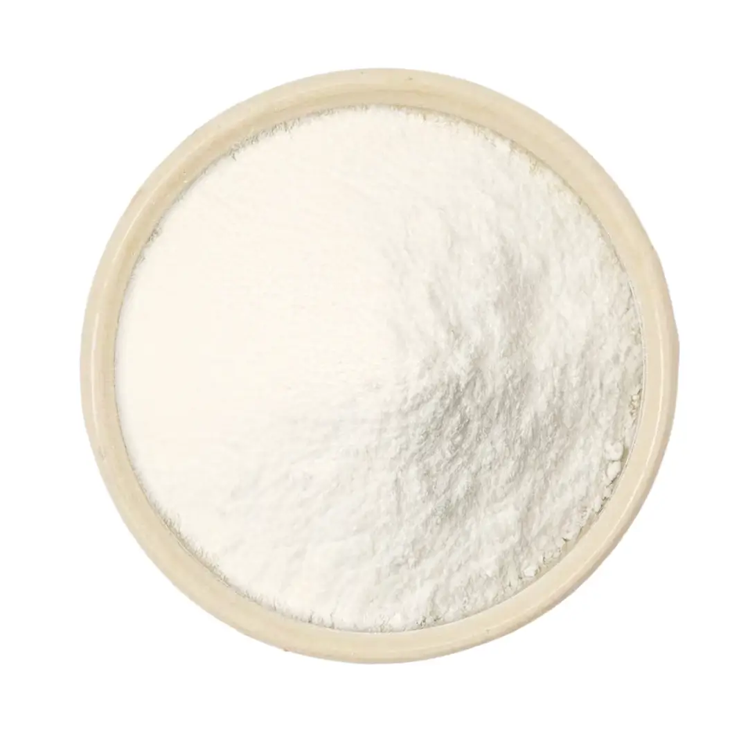 Vogelperspektive auf eine runde Holzschale mit feinem weißen Pulver