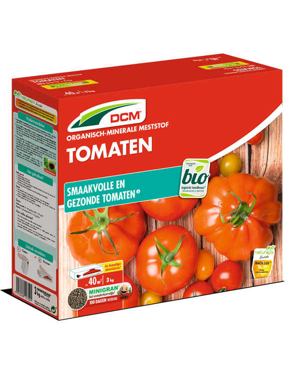 Rode verpakking van DCM Organisch-Minerale Meststof voor Tomaten, met afbeelding van rijpe tomaten.