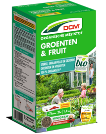 Groene verpakking van DCM Organische Meststof voor Groenten en Fruit, met een afbeelding van een moestuin en een gezin.