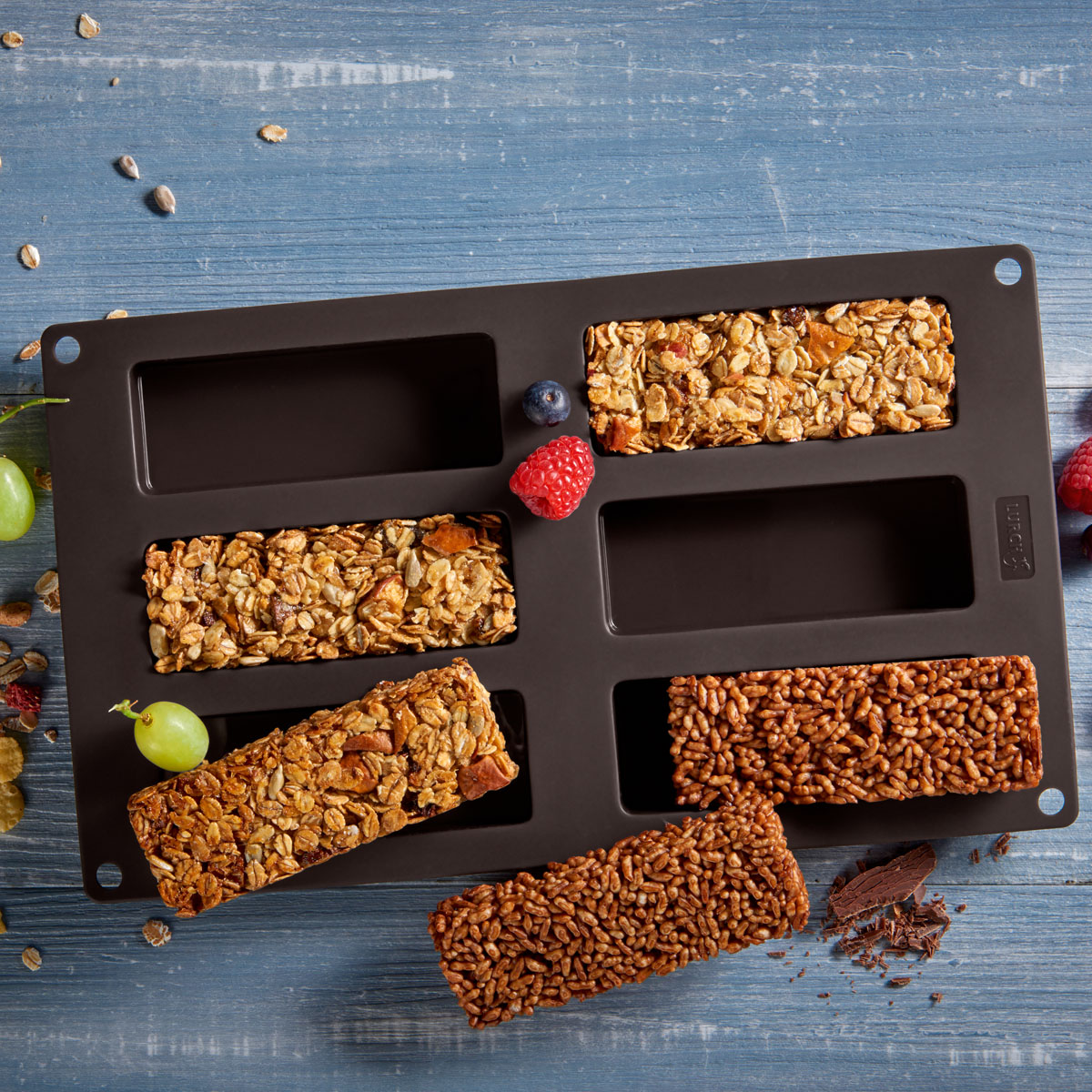Müsliriegel für Kinder: Viele fertige Riegel enthalten zu viel Zucker – unser Rezept zeigt dir, wie du kinderfreundliche Müsliriegel ganz einfach in der Lurch Müslirigelbackform selbst machen kannst!
