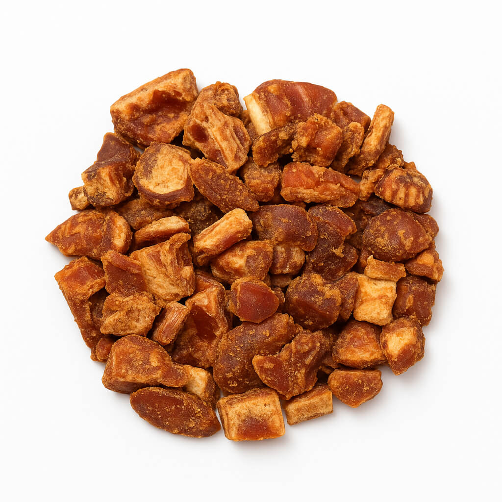 Close-up of dried fruit chunks on white background