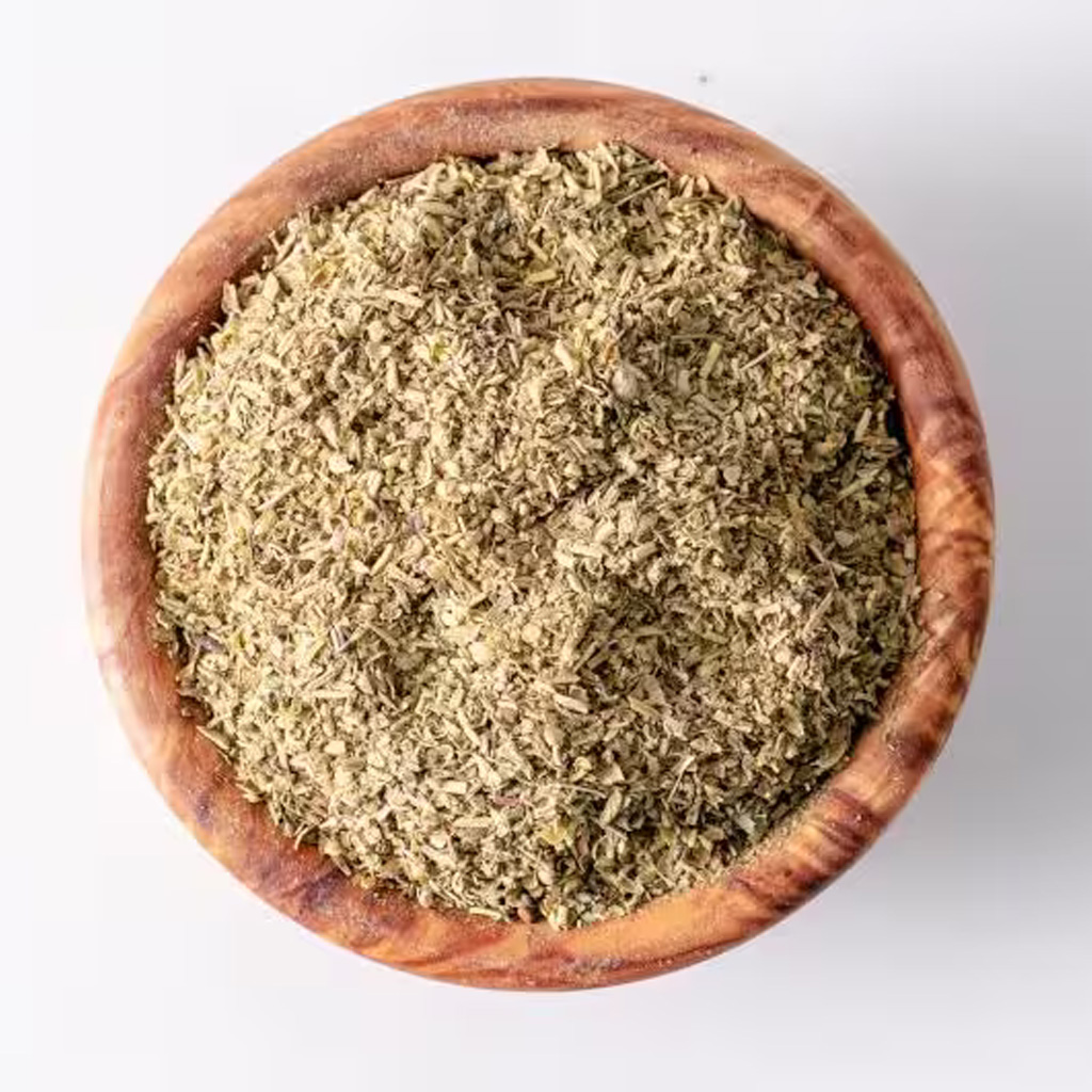 A bowl filled with Herbs de Provence, a traditional blend of herbs used in French cuisine.