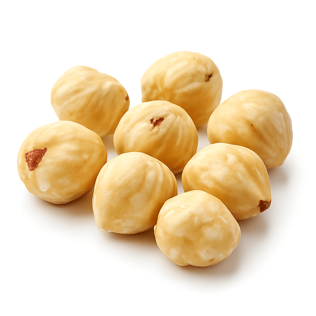 Close-up of shelled hazelnuts on white background