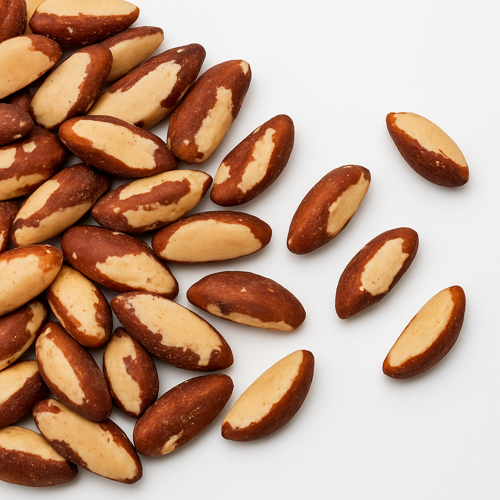 Close-up of shelled Brazil nuts scattered on white