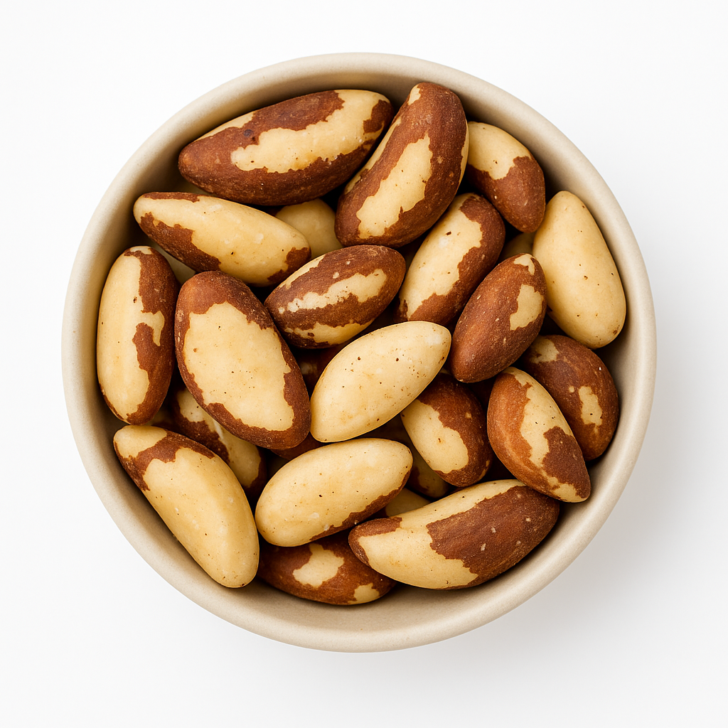 Bowl of shelled Brazil nuts Close-up of shelled Brazil nuts in a beige bowl