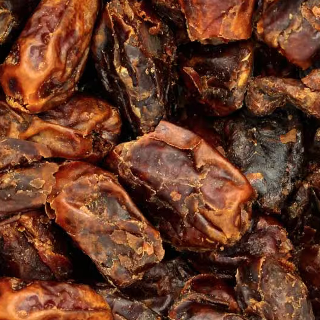 Pile of dried Medjool dates, textured skin