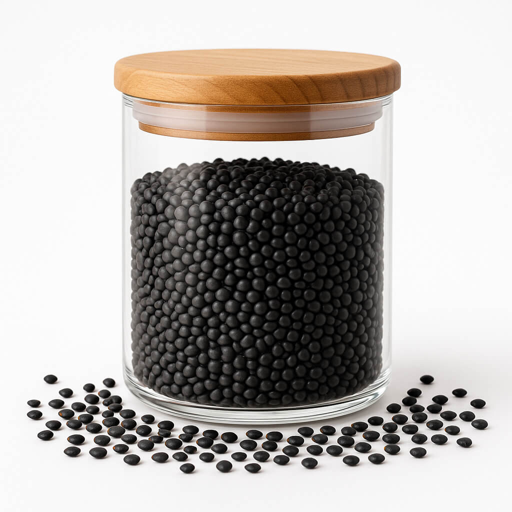 Glass storage jar filled with black lentils