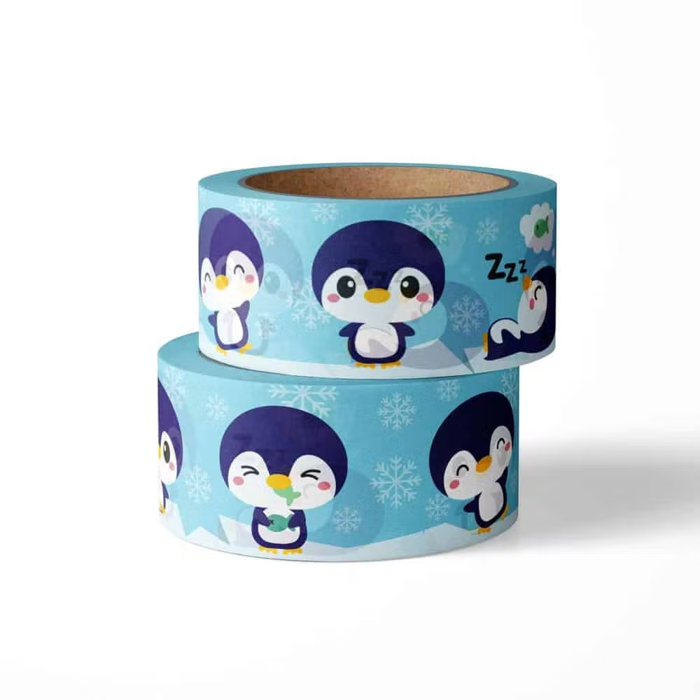 zwei Rollen Washi Tape mit Pinguinen und Schneeflocken