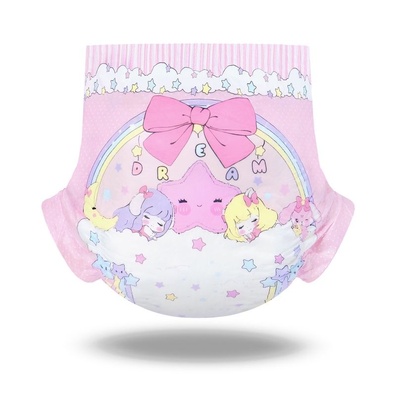 Eine bunte Windel in Pink mit einem fröhlichen, kindlichen Design. Auf der Vorderseite sind Comicfiguren, ein Regenbogen und der Text -DREAM- abgebildet. Das Produkt hat eine runde Form und eine weiche Oberfläche.